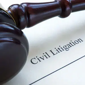  Gavel resting on a document labeled Civil Litigation - Kollias Law